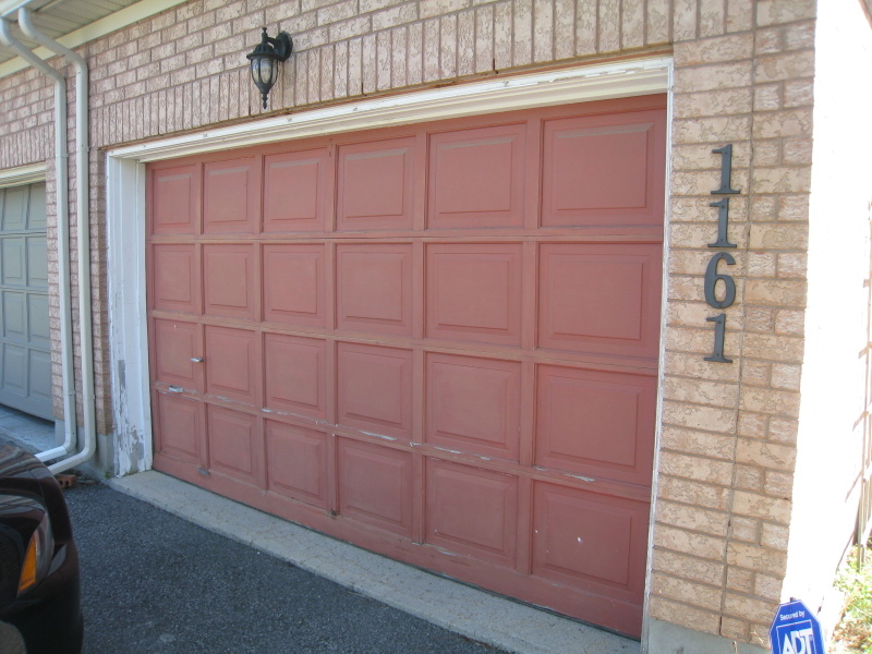 Brown garage door in need of paint
